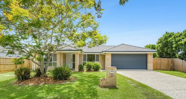 The frontage of the client's Morayfield investment property, with its garden and double garage